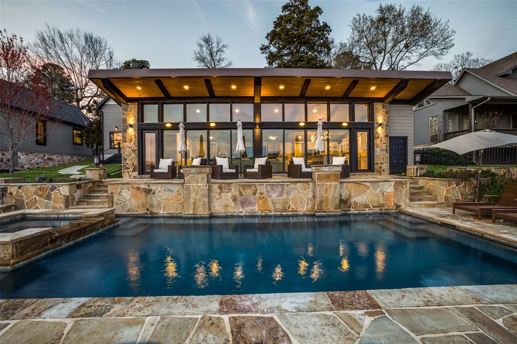 260 Cypress Marina Road Scroggins, TX 75480 - Photo 1 of 40 a front view of a house with swimming pool