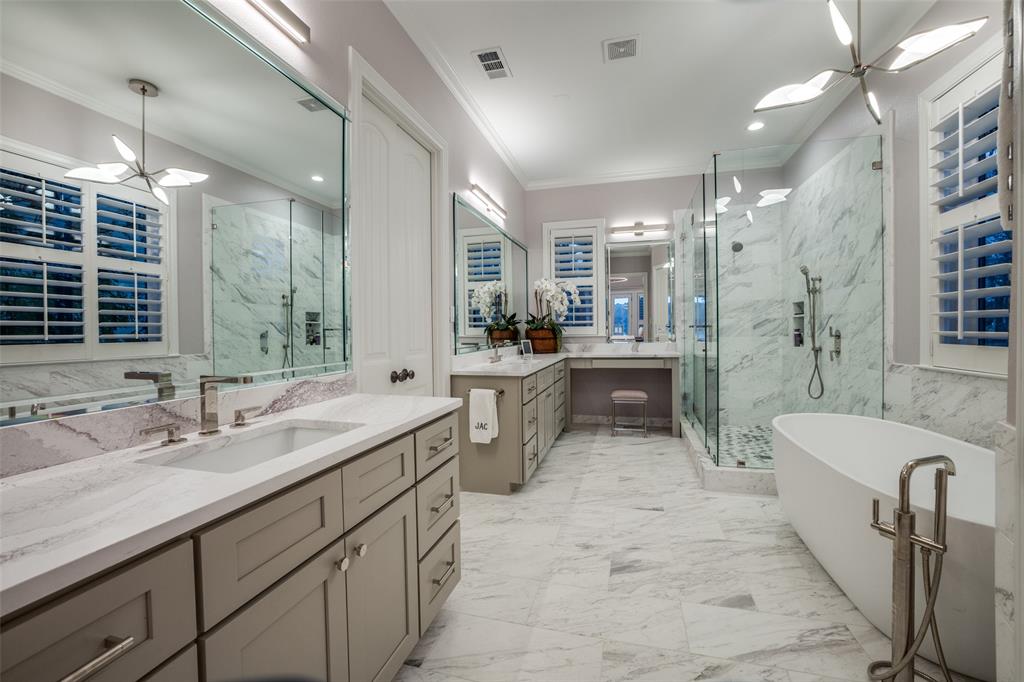 260 Cypress Marina Road Scroggins, TX 75480 - Photo 20 of 40 a bathroom with double vanity sink a mirror a bathtub and shower