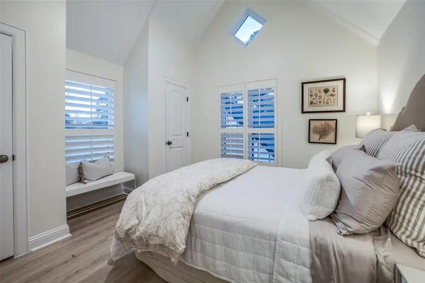 a bedroom with a large bed and a closet