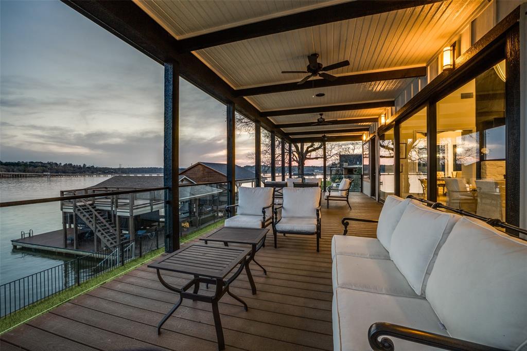260 Cypress Marina Road Scroggins, TX 75480 - Photo 37 of 40 a balcony with wooden floor outdoor seating and city view