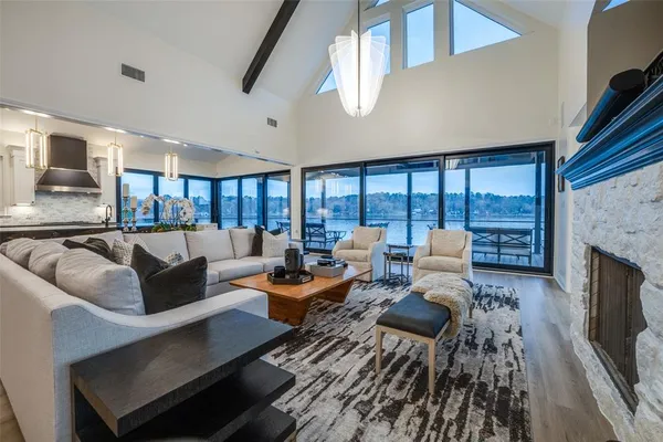 a living room with furniture fireplace and a flat screen tv