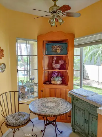 a kitchen with a refrigerator sink stove and cabinets