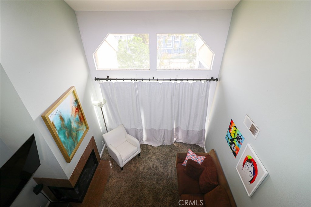 20331 Bluffside Circle, Unit 417 Huntington Beach, CA 92646 - Photo 15 of 32 a view of hallway with couch and a window