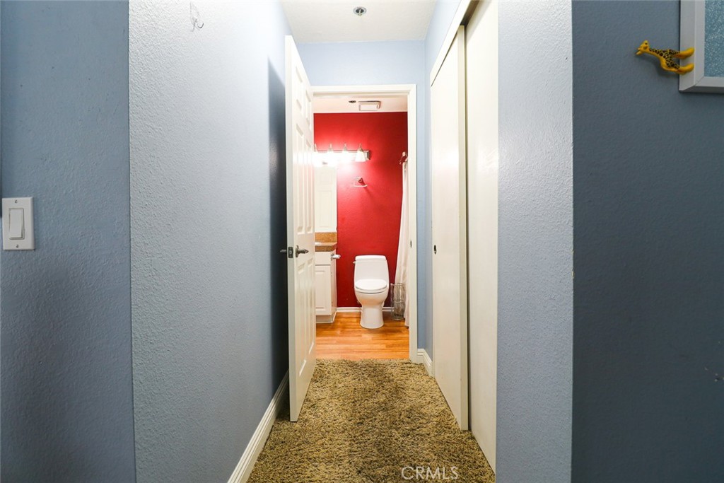 20331 Bluffside Circle, Unit 417 Huntington Beach, CA 92646 - Photo 21 of 32 a view of a bathroom from a hallway