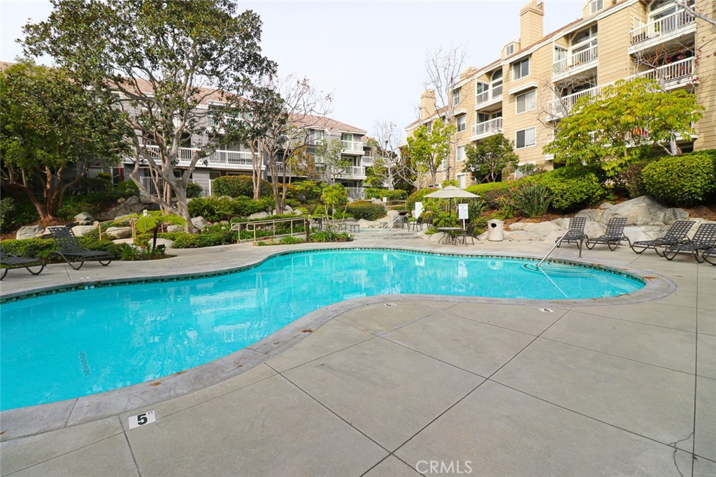 20331 Bluffside Circle, Unit 417 Huntington Beach, CA 92646 - Photo 23 of 32 a view of a garden with a lounge chair