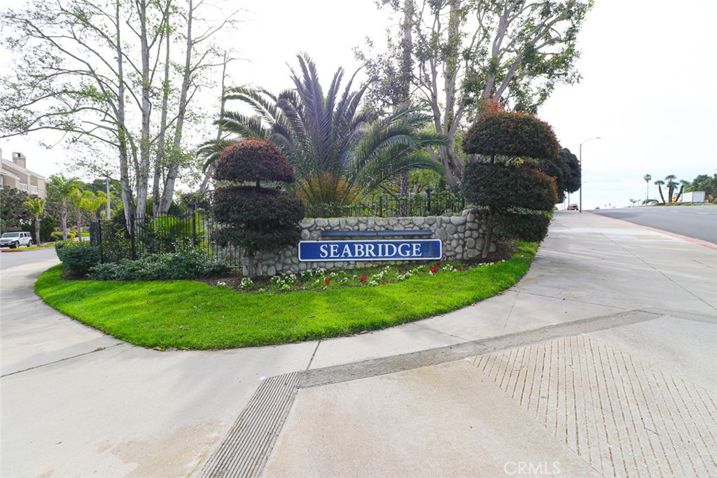 20331 Bluffside Circle, Unit 417 Huntington Beach, CA 92646 - Photo 29 of 32 a view of a park that has a sign board