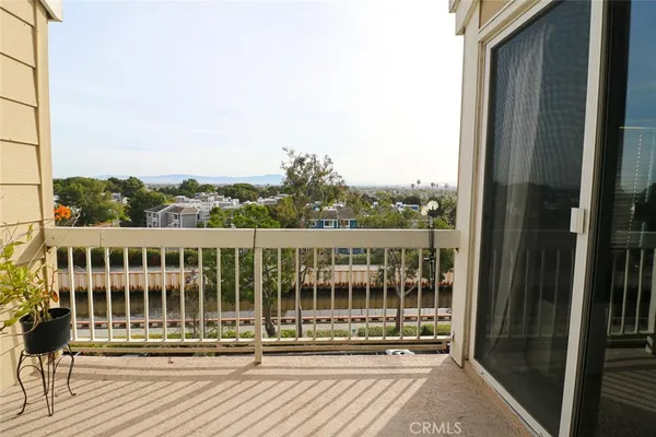 a view of a balcony with wooden floor