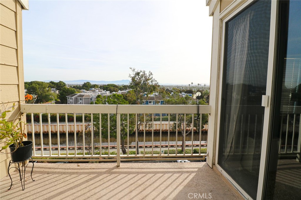 20331 Bluffside Circle, Unit 417 Huntington Beach, CA 92646 - Photo 7 of 32 a view of a balcony with wooden floor