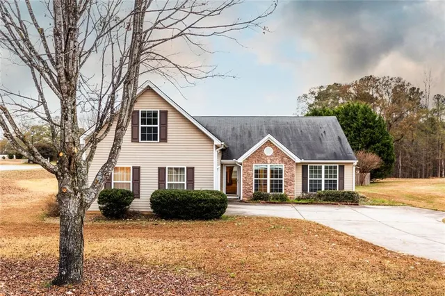 a front view of a house with a yard