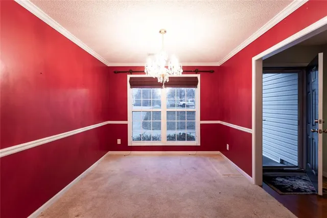 a view of a room with large windows