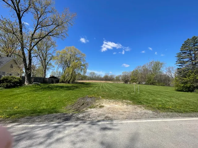 a view of a playground with a house