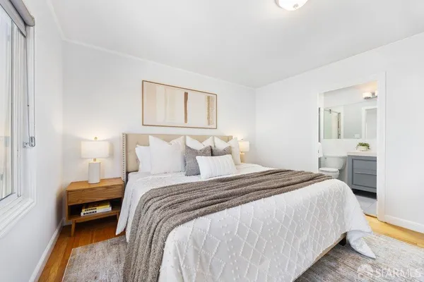 a bedroom with a bed and a couch