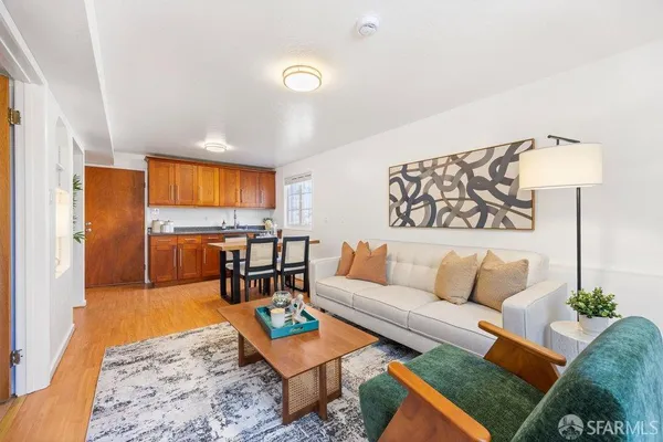 a living room with furniture and a table