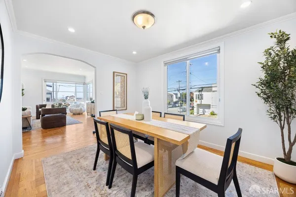 a dining room with furniture and window