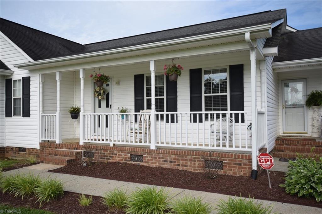 4596 Reid Road Elon, NC 27244 - Photo 2 of 21 Great porch, side entry goes to kitchen area