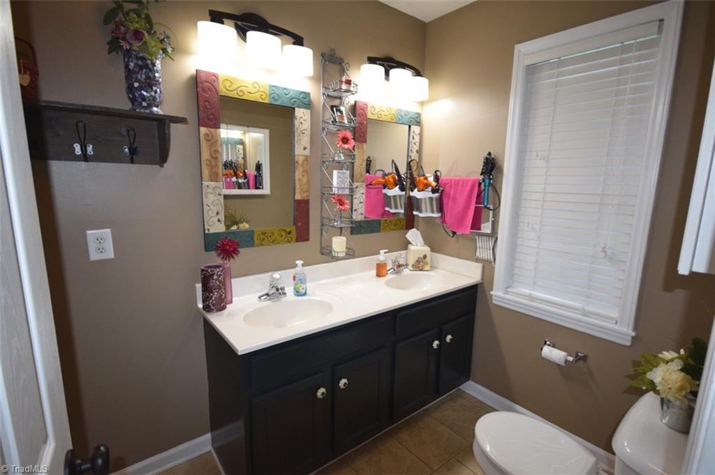 4596 Reid Road Elon, NC 27244 - Photo 12 of 21 master bathroom, tile floors, full size shower (no tub)