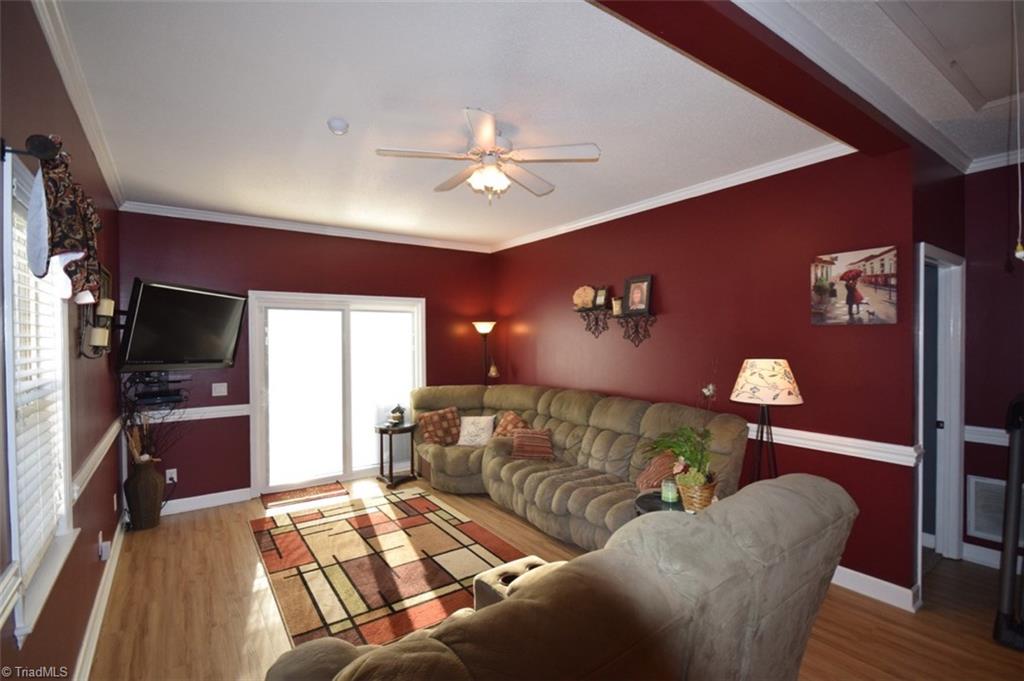 4596 Reid Road Elon, NC 27244 - Photo 8 of 21 Living Room, sliding doors with built in blinds to rear deck and awesome back yard.