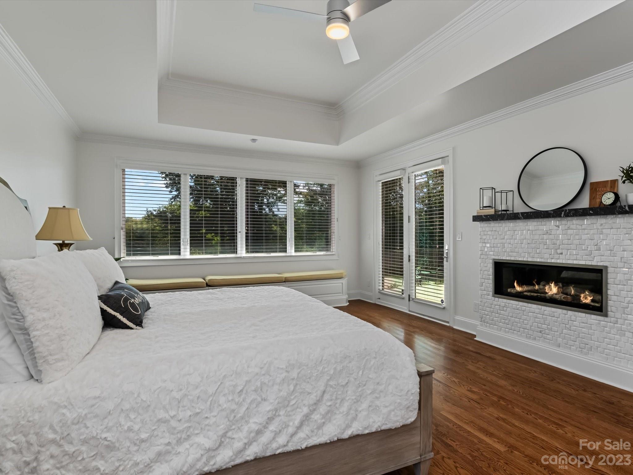18916 Riverwind Lane Davidson, NC 28036 - Photo 12 of 25 a spacious bedroom with a large bed and a large window