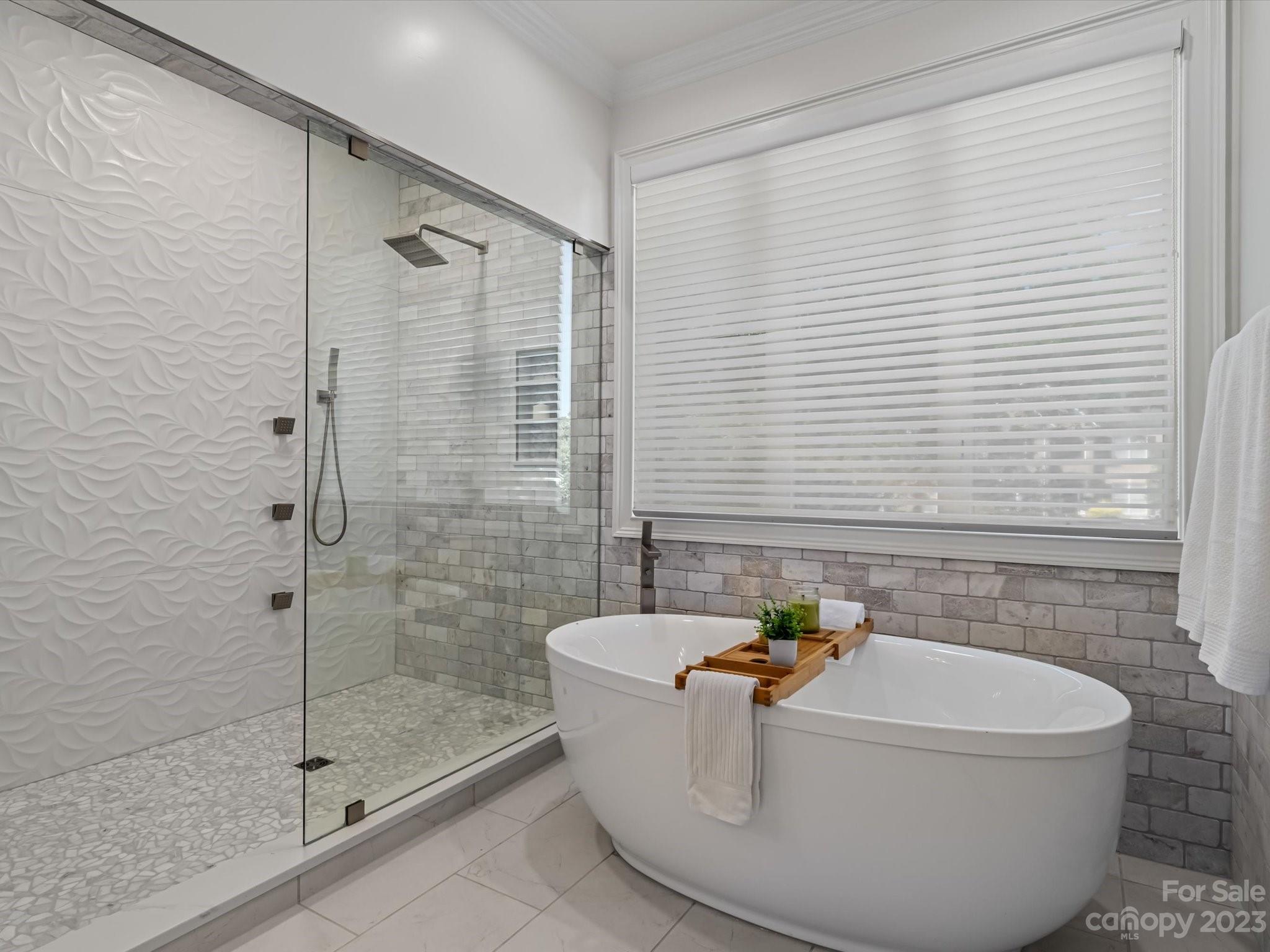 18916 Riverwind Lane Davidson, NC 28036 - Photo 14 of 25 a white bath tub sitting next to a shower