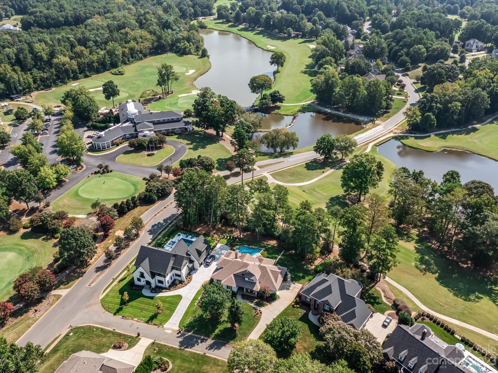 18916 Riverwind Lane Davidson, NC 28036 - Photo 2 of 25 an aerial view of residential house with outdoor space and swimming pool