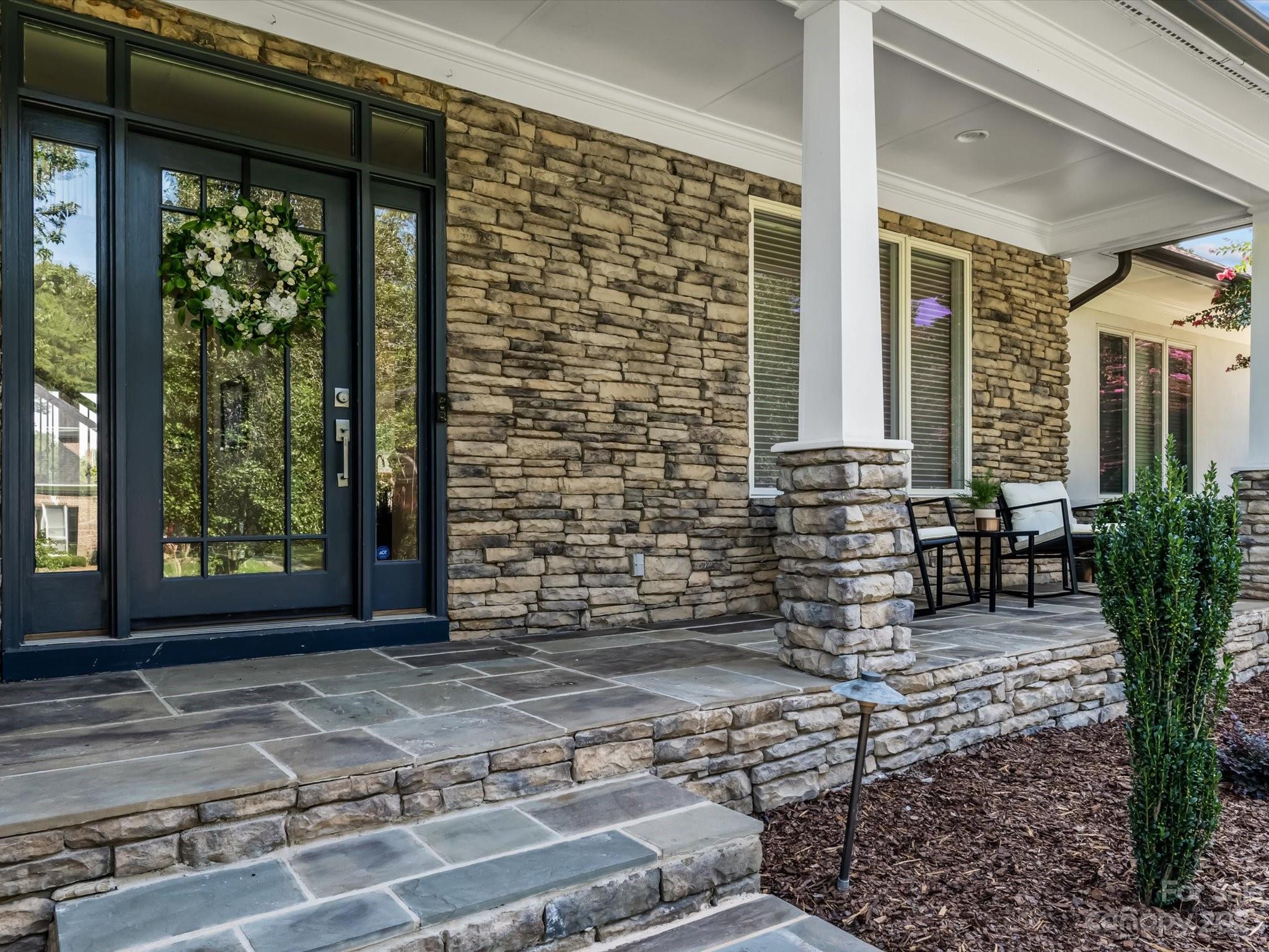18916 Riverwind Lane Davidson, NC 28036 - Photo 24 of 25 a front view of a house with garden
