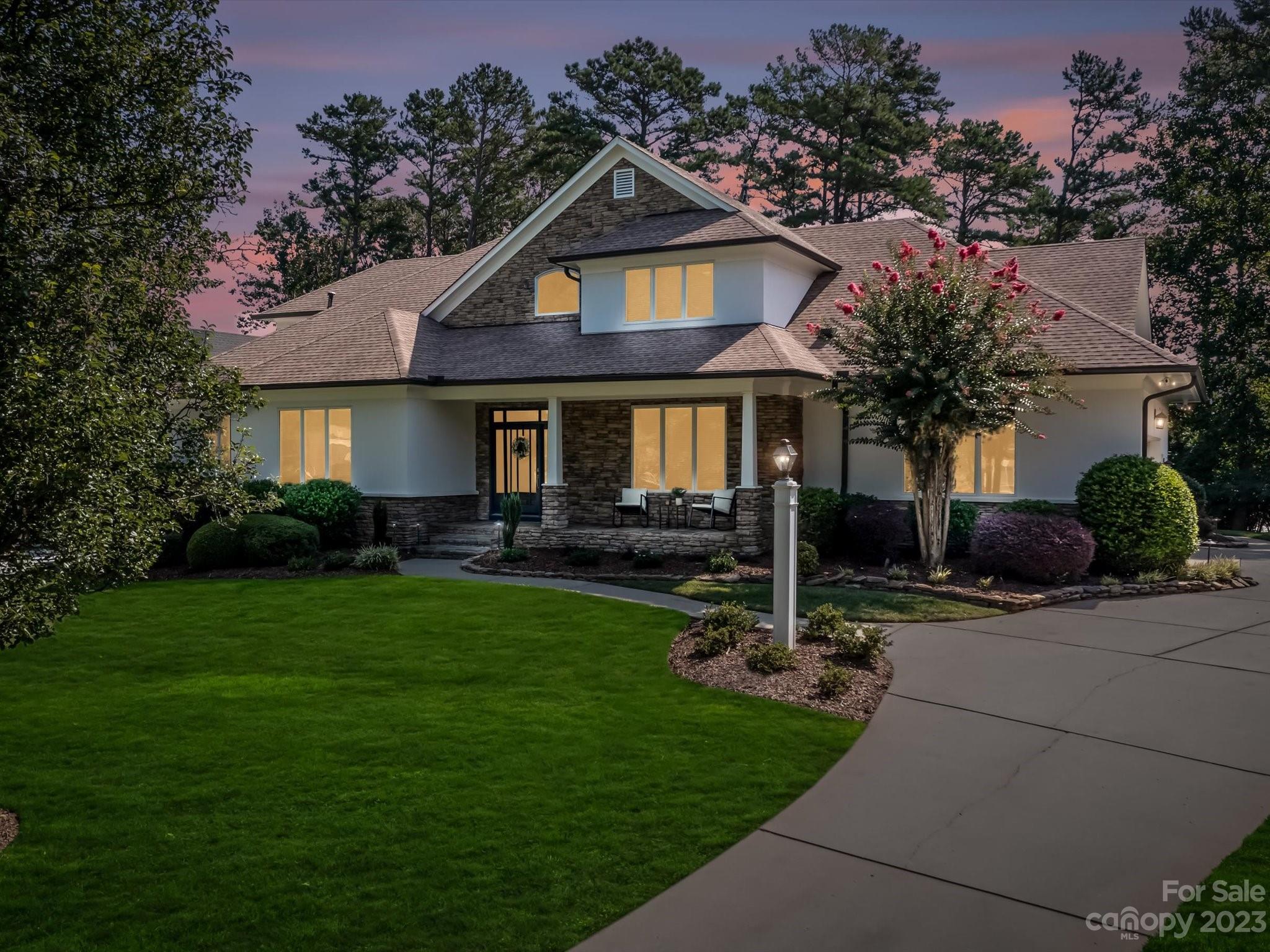 18916 Riverwind Lane Davidson, NC 28036 - Photo 25 of 25 a front view of a house with garden