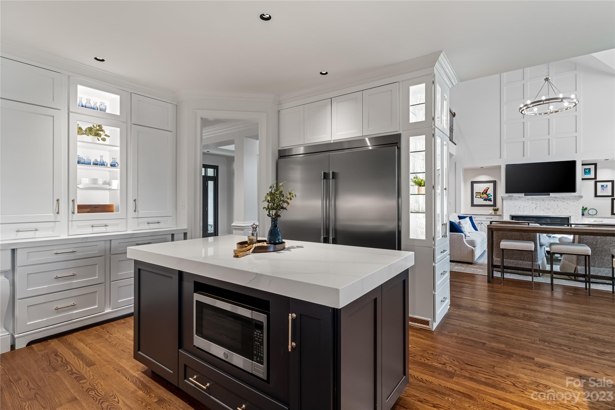 18916 Riverwind Lane Davidson, NC 28036 - Photo 9 of 25 a kitchen with stainless steel appliances a stove microwave and refrigerator