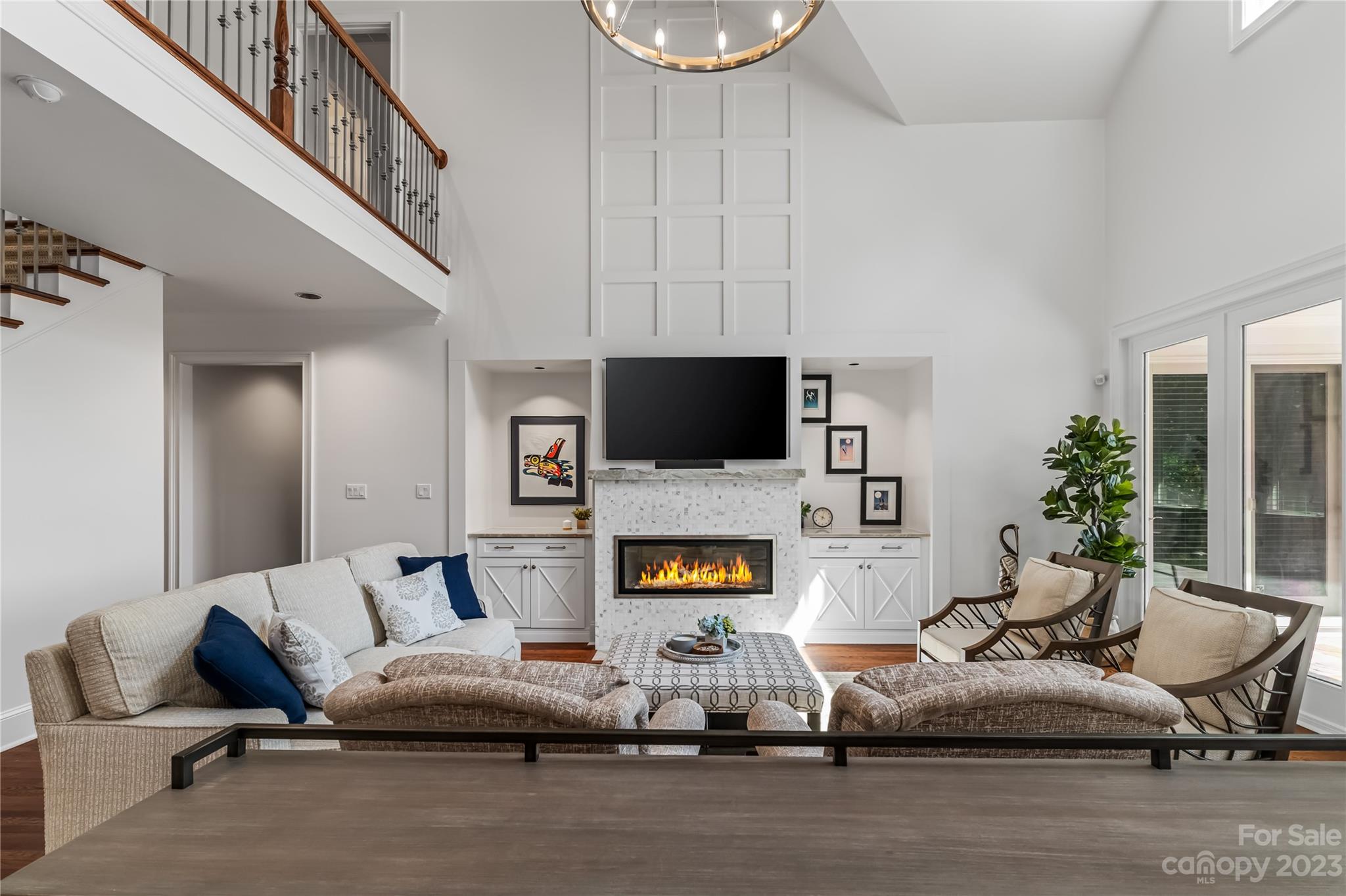 18916 Riverwind Lane Davidson, NC 28036 - Photo 10 of 25 a living room with furniture and a flat screen tv