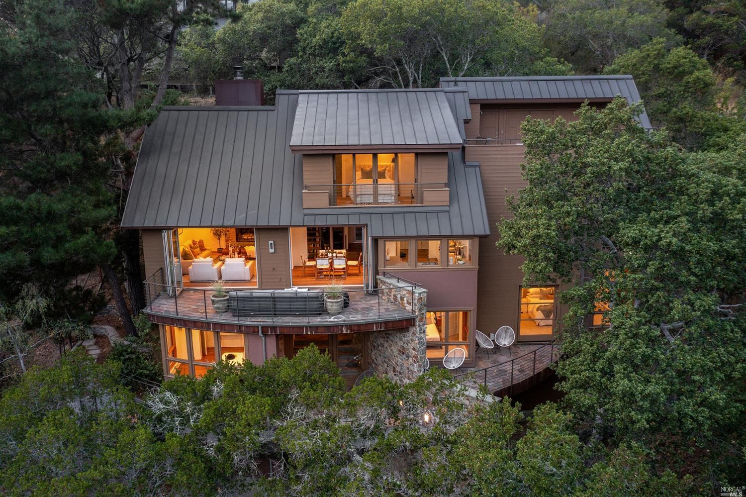 an aerial view of a house with balcony and outdoor space