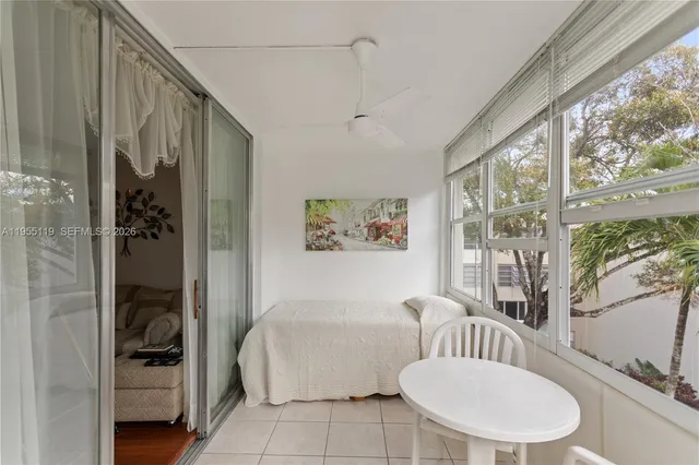 a bathroom with a toilet tub and shower