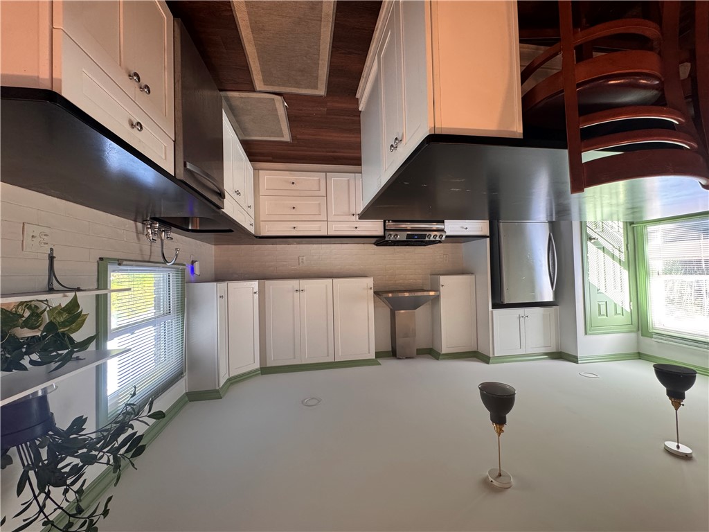 2211 East River Street Anderson, SC 29621 - Photo 19 of 40 This bright kitchen features ample cabinetry and a window with natural light.