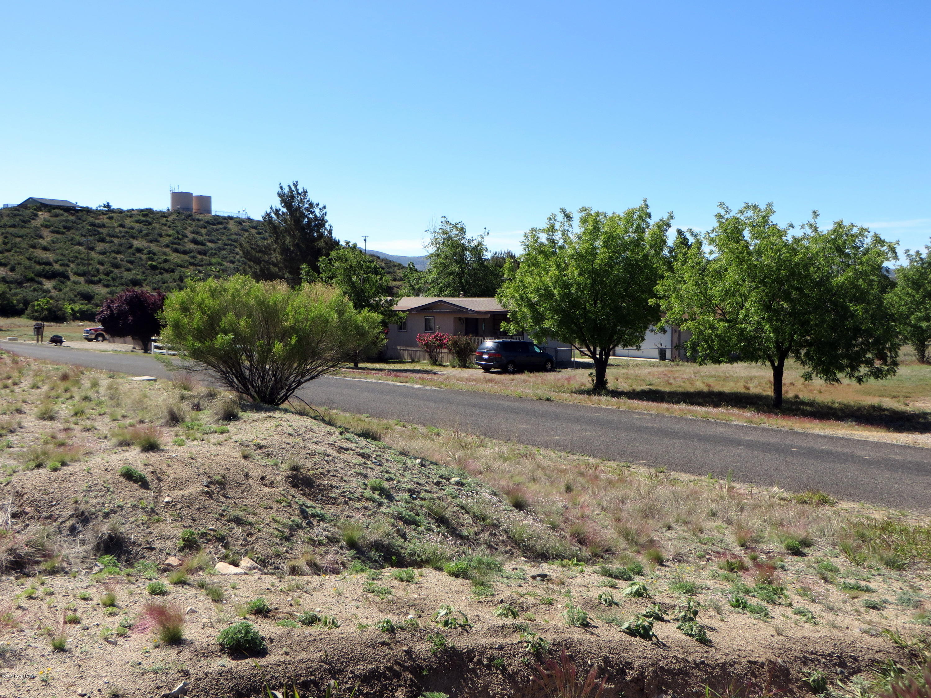17026 Double Tree Road Peeples Valley, AZ 86332 - Photo 5 of 5 a view of road with a building