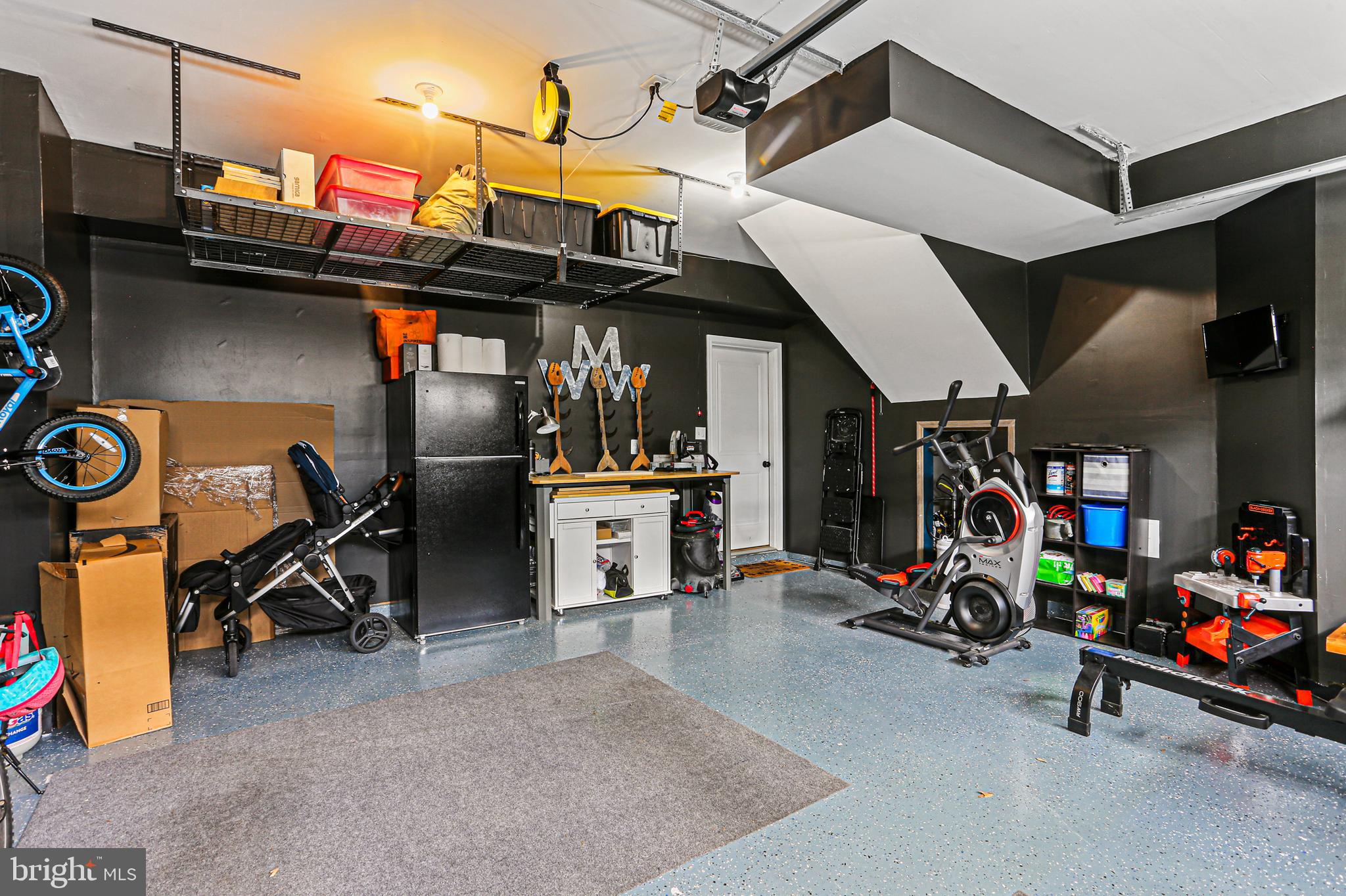 8319 Kippis Road Millersville, MD 21108 - Photo 31 of 49 Finished garage with extra storage and EV charger