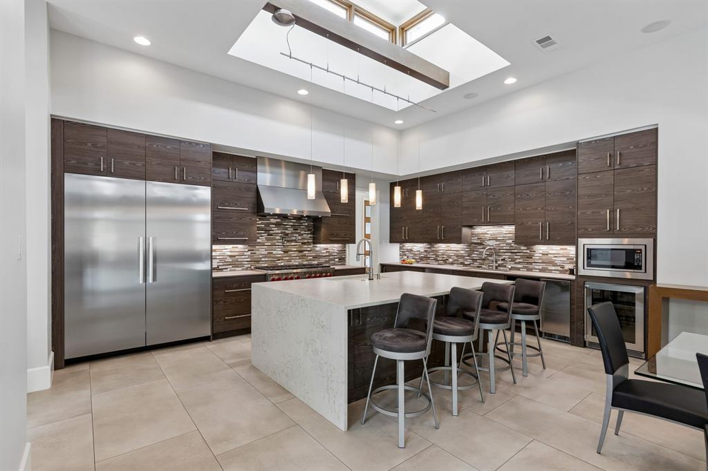 548 Oak Grove Lane Coppell, TX 75019 - Photo 8 of 36 a kitchen with a table and chairs