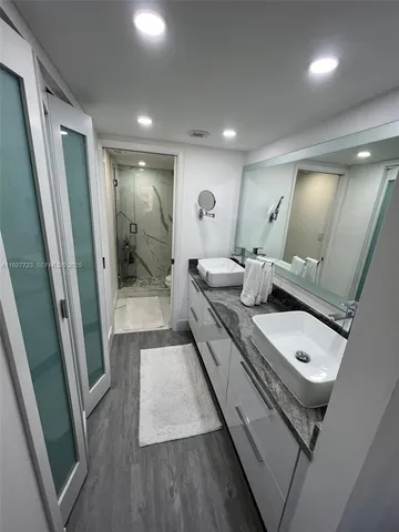 a bathroom with a sink and mirror