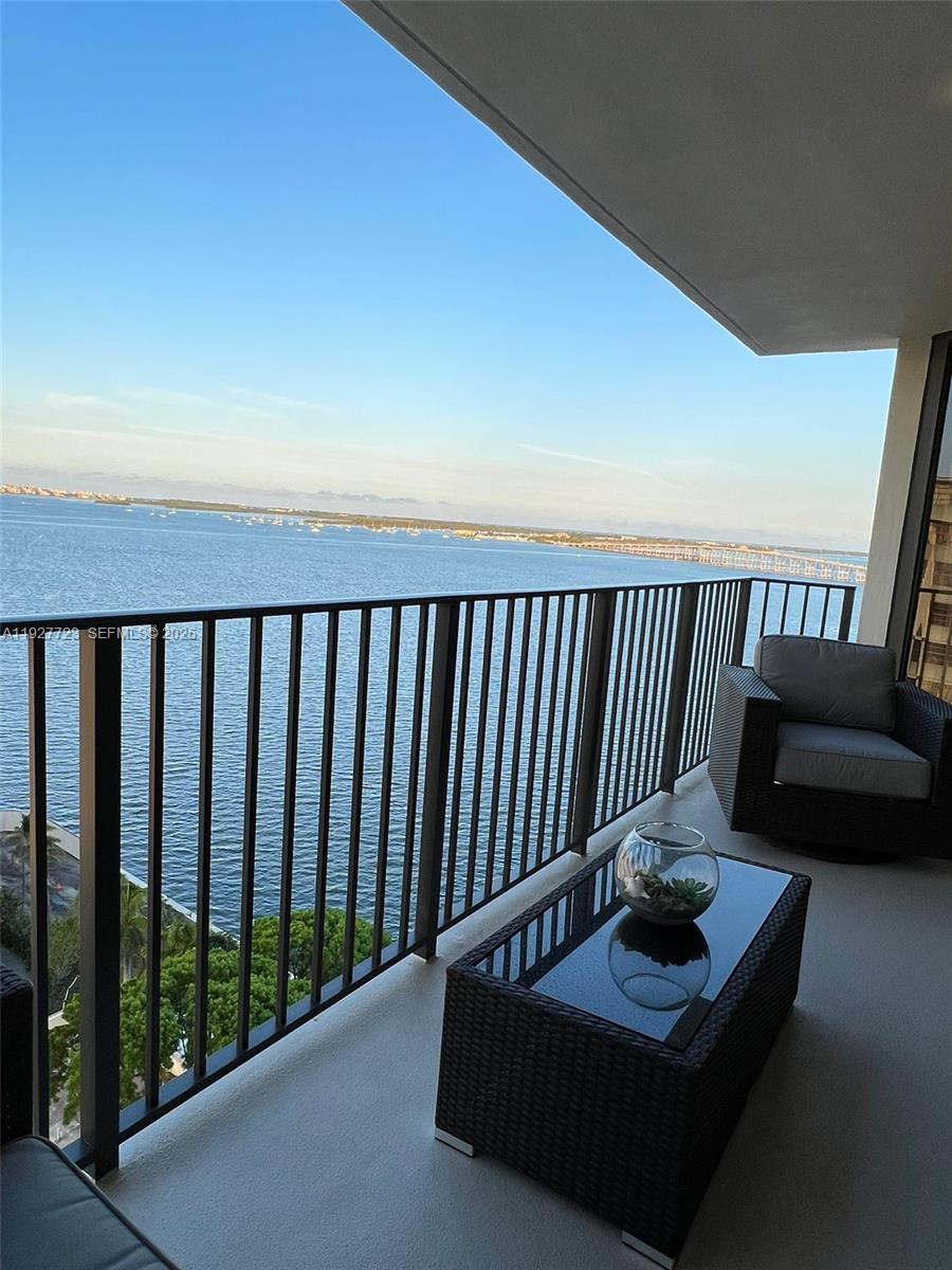 1865 Brickell Avenue, Unit A1607 Miami, FL 33129 - Photo 3 of 15 a balcony with couch and a potted plant