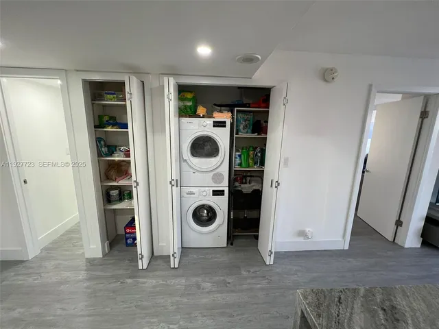 a view of a storage & utility room with washer and dryer