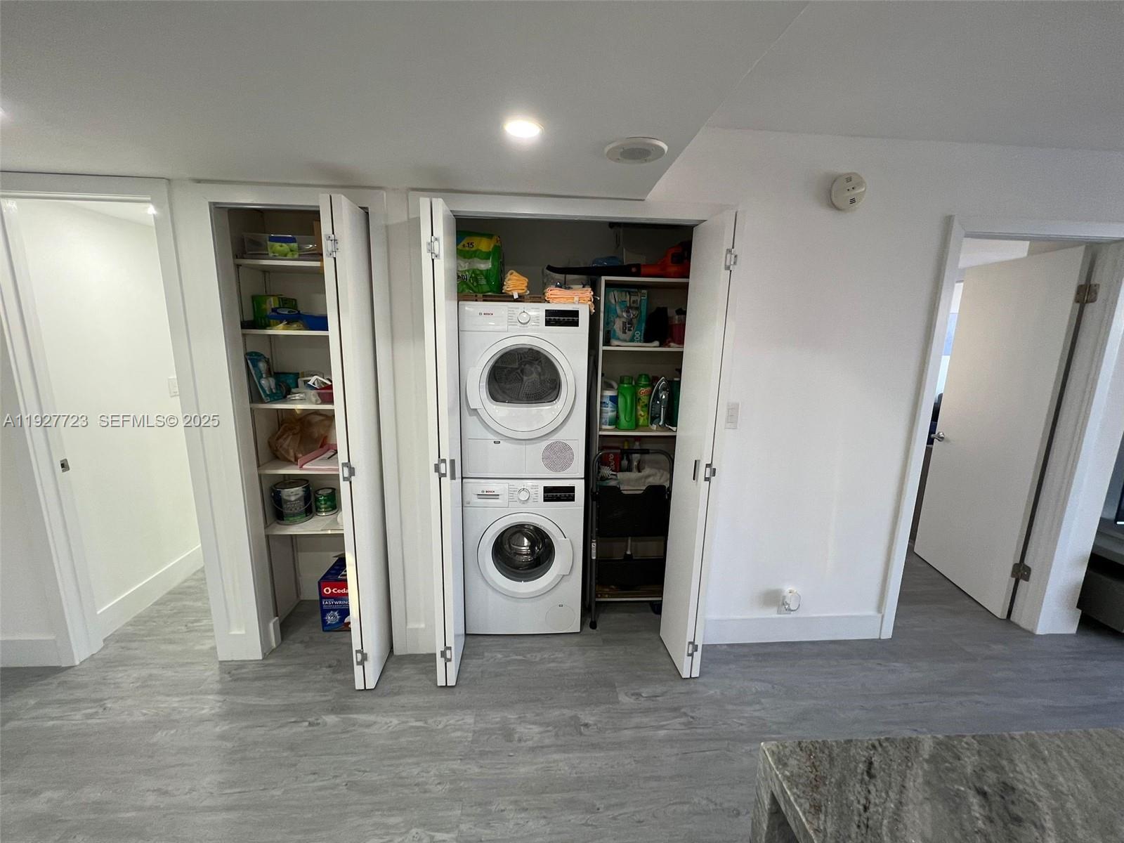 1865 Brickell Avenue, Unit A1607 Miami, FL 33129 - Photo 7 of 15 a view of a storage & utility room with washer and dryer