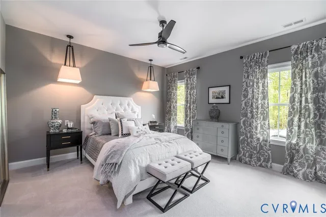 a bedroom with bed and window with lamp