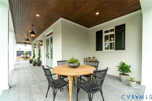 a dining room with furniture and window