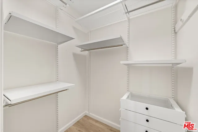 a view of an empty walk in closet