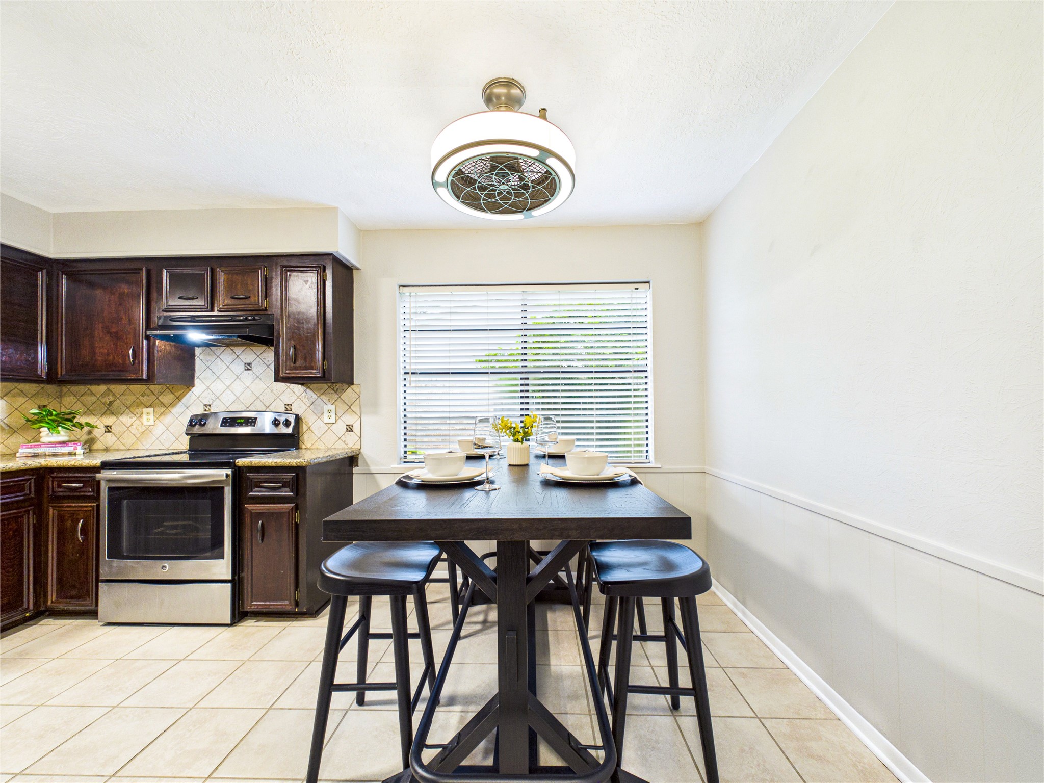 10306 Rustic Rock Road La Porte, TX 77571 - Photo 13 of 38 a kitchen with a table and chairs in it