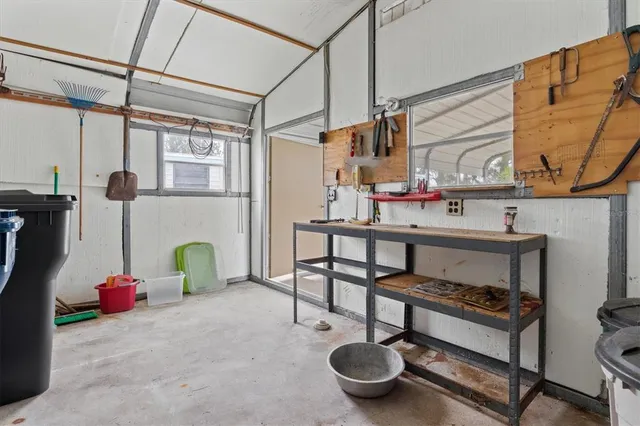 an aerial view of residential houses with outdoor space and swimming pool