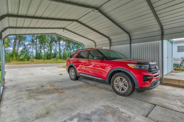 a view of swimming pool with outdoor seating and city view