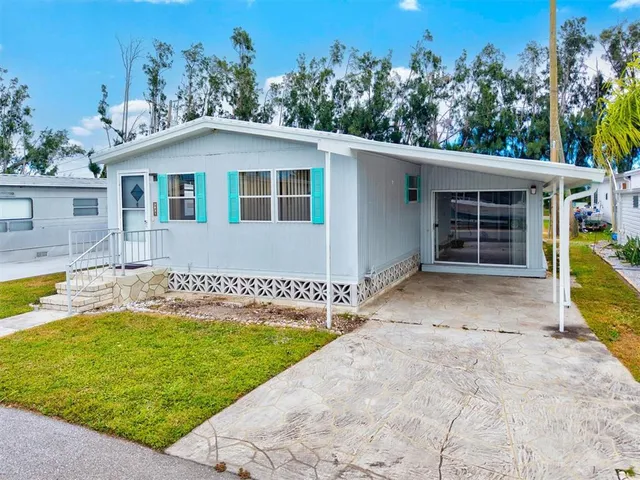 a view of a entryway with lots of different kinds of flowers
