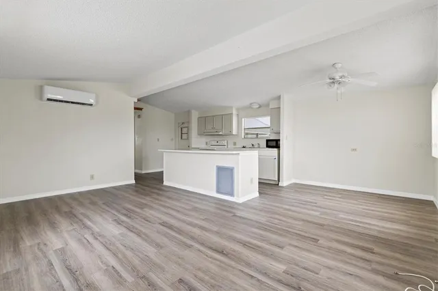 a view of a kitchen with wooden floor