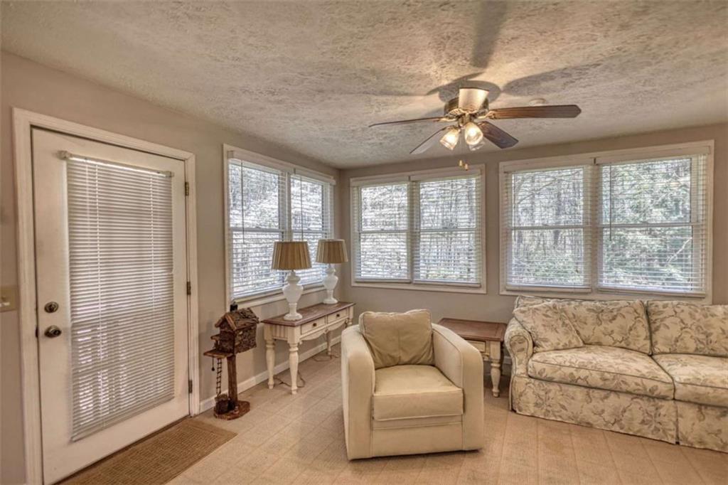 2740 Dennard Road Northeast Conyers, GA 30013 - Photo 17 of 51 a living room with furniture and a large window