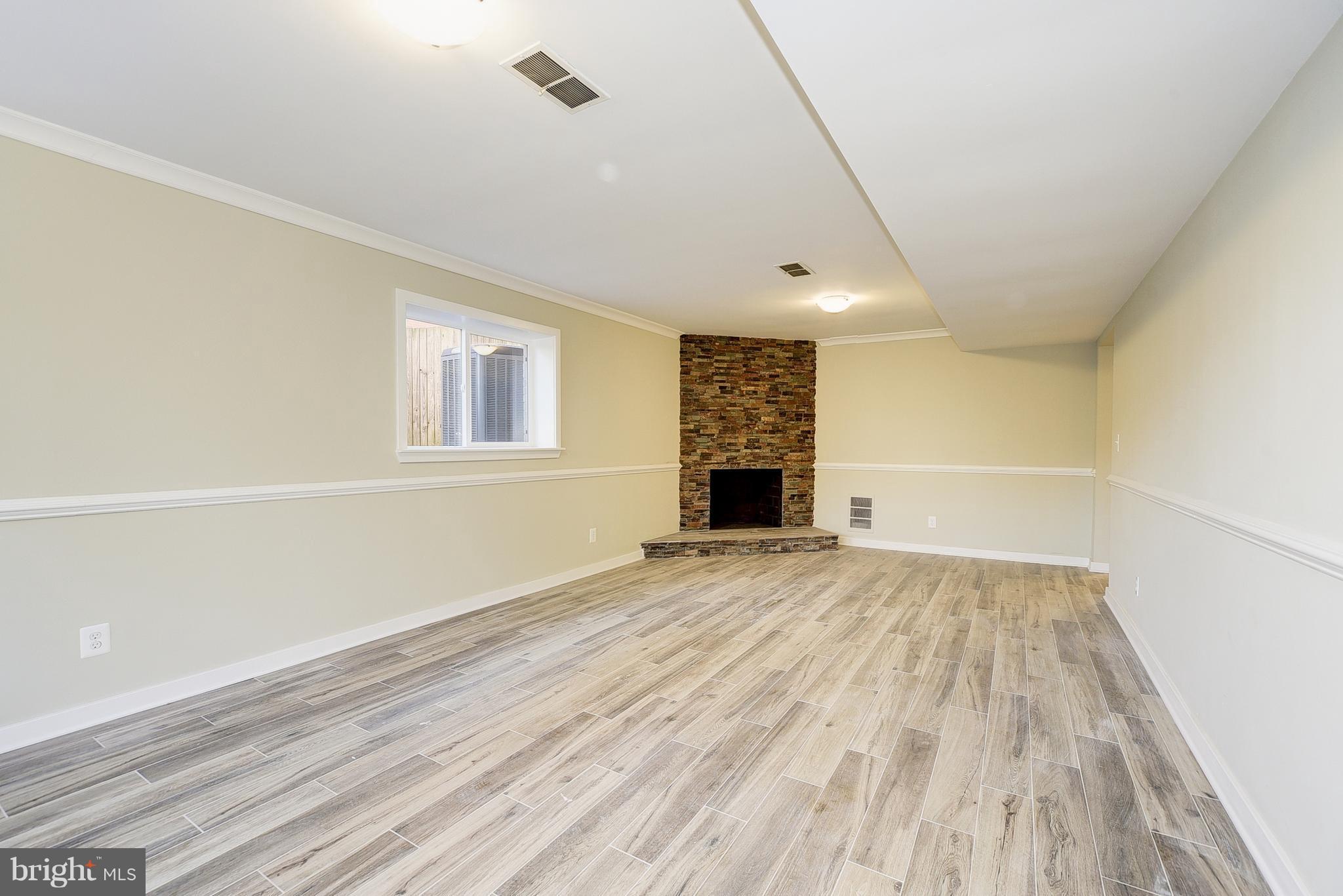7413 Beverly Road Bethesda, MD 20814 - Photo 27 of 30 Rec Room w/FP