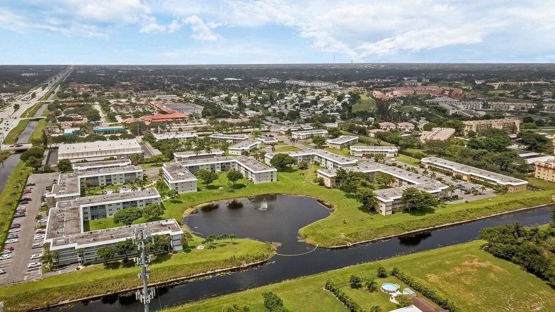 9826 Marina Boulevard, Unit 1015 Boca Raton, FL 33428 - Photo 2 of 12 an aerial view of residential houses with outdoor space