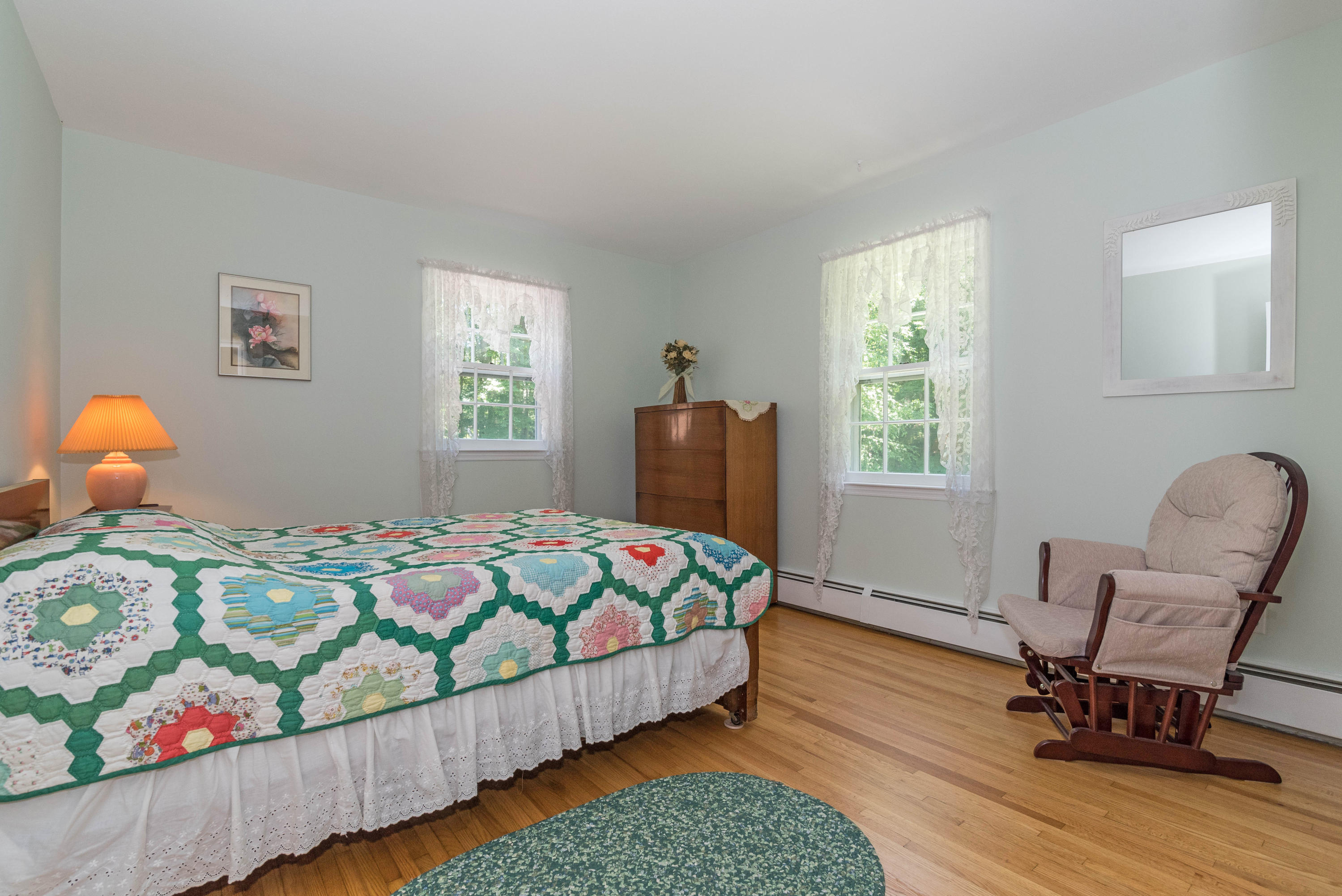 24 Hannahs Road Stamford, CT 06903 - Photo 21 of 28 a bedroom with a bed and wooden floor